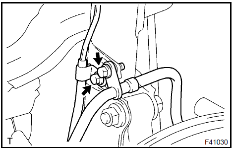 b. Loosen the 2 nuts on the lower side of the shock absorber.