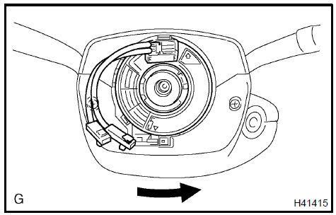 d. Rotate the spiral cable sub−assy clockwise approximately