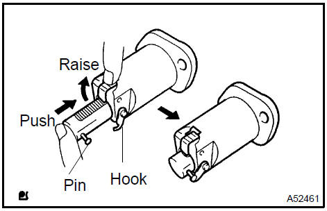b. Install a new gasket and the chain tensioner with the 2