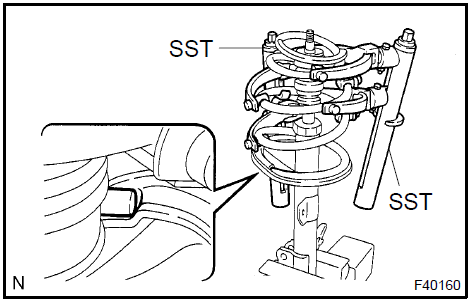 e. Install the front coil spring insulator upper LH as shown in