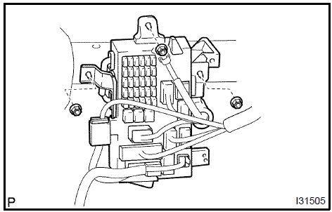 b. Remove the 2 nuts and steering side connector block.