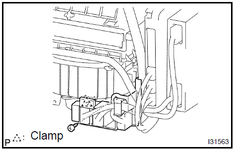 c. Disconnect the 6 clamps and the wire harness.