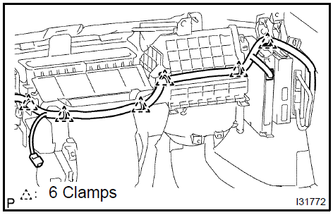 d. Remove the 2 screws, 2 nuts and blower assy.