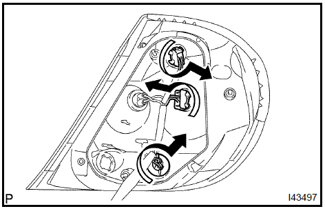 Remove rear combination lamp bulb