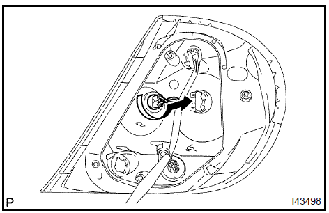 Remove rear combination lamp bulb