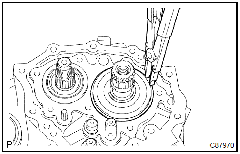 Remove input shaft rear bearing shaft snap ring