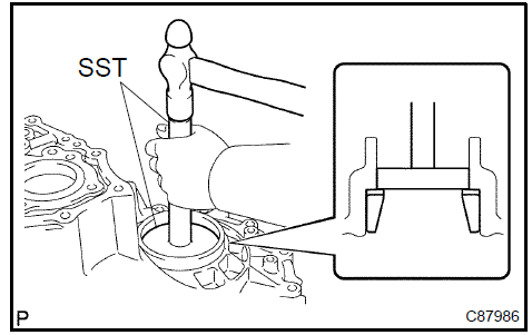 b. Using SST, remove the FR differential case front tapered