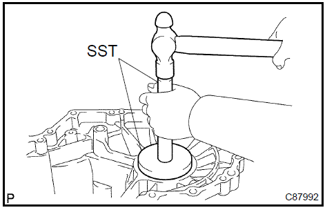 c. Using SST, remove the FR differential case front tapered