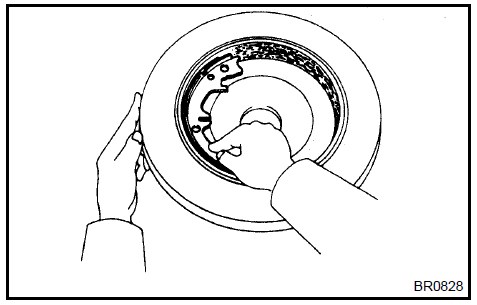 Inspect brake disc and parking brake shoe lining for proper contact