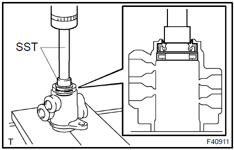 Remove power steering control valve upper oil seal