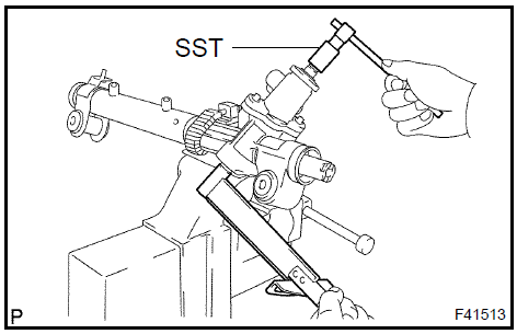 p. Using a socket wrench (27 mm), install the rack housing