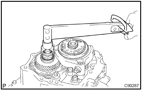 c. Using a chisel and a hammer, stake the manual transmission