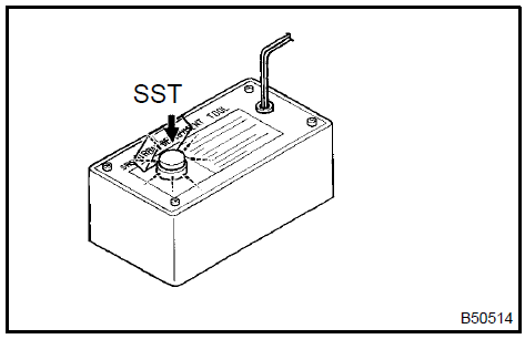 b. Disconnect the pretensioner connector.