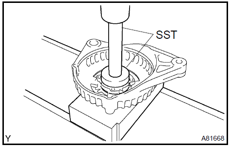 b. Install the retainer plate with the 4 screws.Torque: 2.3
