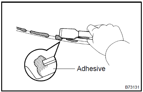 25. INSTALL WINDSHIELD MOULDING OUTER UPPER