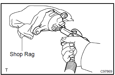 Remove front disc brake piston