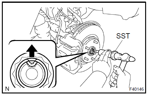 Remove front axle hub LH nut