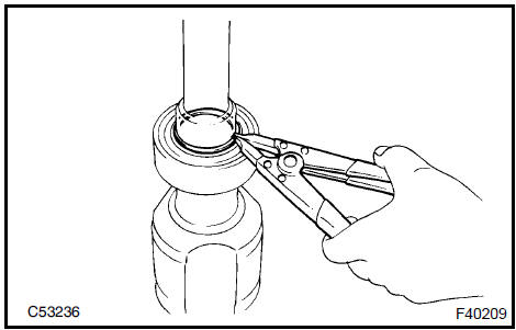 Remove front drive shaft bearing