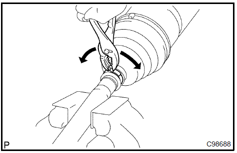 Remove front axle inboard joint boot LH clamp