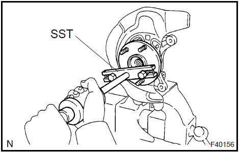 b. Using SST and a press, remove the bearing inner race