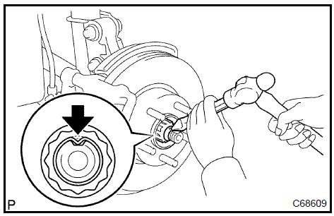  Install front axle hub LH nut