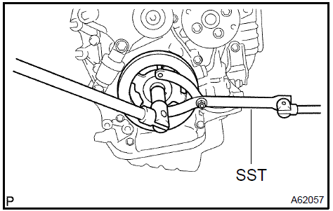 2. Using SST, remove the crankshaft pulley.
