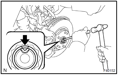 Install front axle hub LH nut