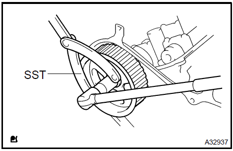 b. Using SST, remove the bolt and LH timing pulley.