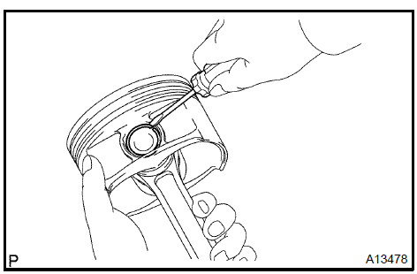  Remove piston pin hole snap ring