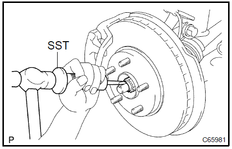  Remove front axle hub LH nut