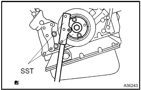 b. Remove the 8 bolts, the rear spacer, the drive plate and