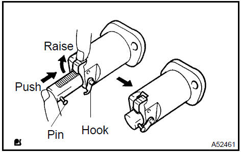 2. Install a new gasket and the chain tensioner with the