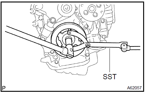 2. Using SST, remove the crankshaft pulley.