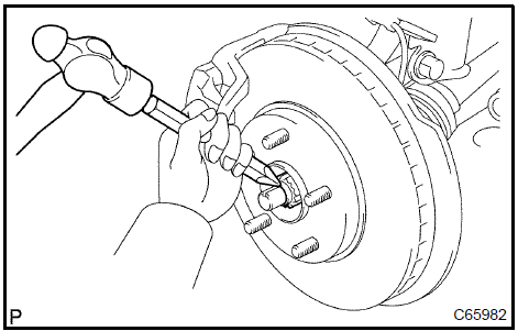 Install front axle hub LH nut