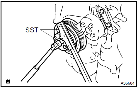 2. Using SST, remove the bolt and pulley.