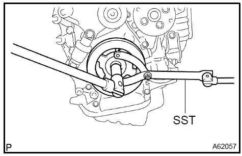 2. Using SST, remove the crankshaft pulley.